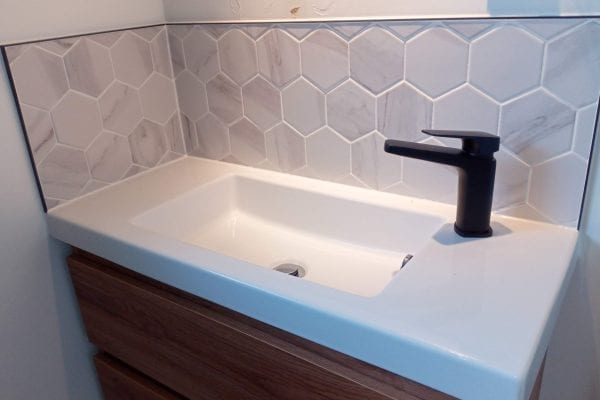 Hexagon tiles above a vanity
